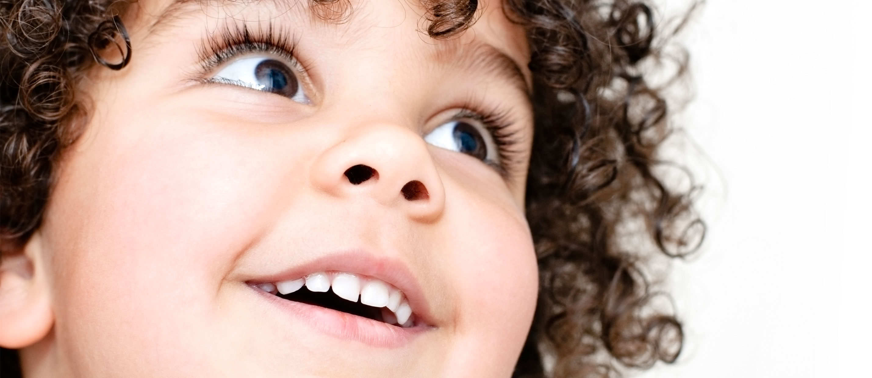 iStock_000011886871XLarge-child-with-her-toothy-smile